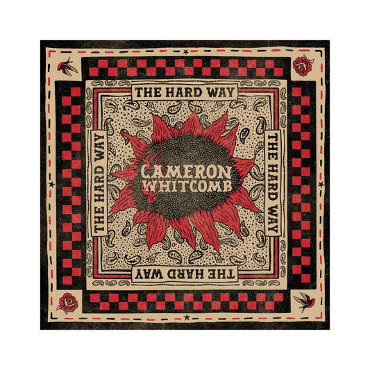 Bandana with red sunflower design and text 'The Hard Way' by Cameron Whitcomb on a black background