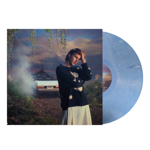 Ruel 4th wall vinyl with blue and white marbled record coming out of sleeve