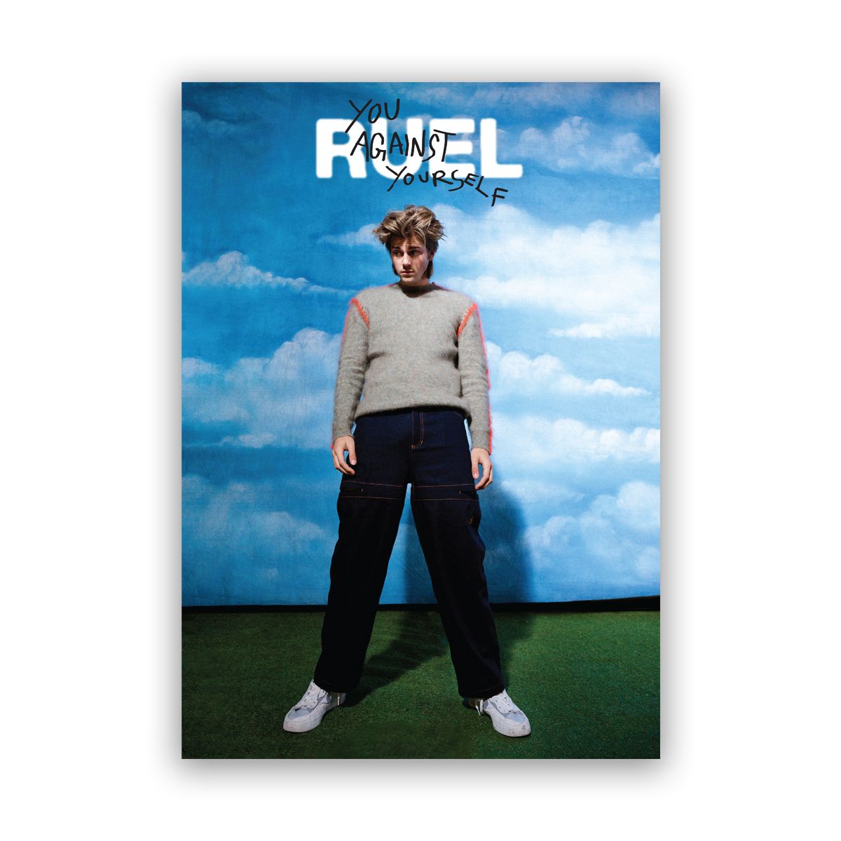 Poster of Ruel in jeans and grey sweater, against cloud background. With RUEL Logo and 'you against yourself' written in marker on top
