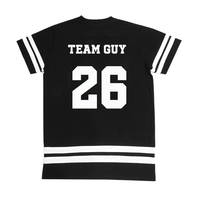 Back of black and white varsity college style jersey. TEAM GUY text at top, and number 26 in middle. White stripes on sleeves and t-shirt bottom